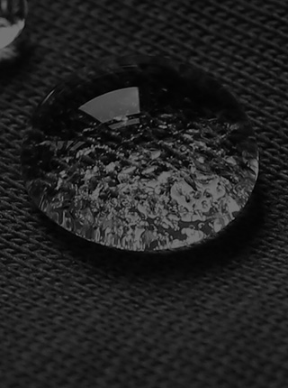 Water beading on an article of Filium-activated natural fabric [Mobile crop]